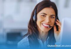 a call center agent smiling while talking to a customer using headphones