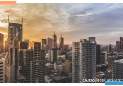 an image of buildings with a sunset