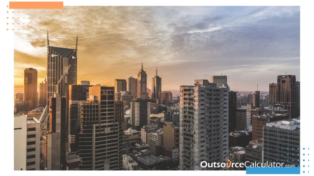 an image of buildings with a sunset