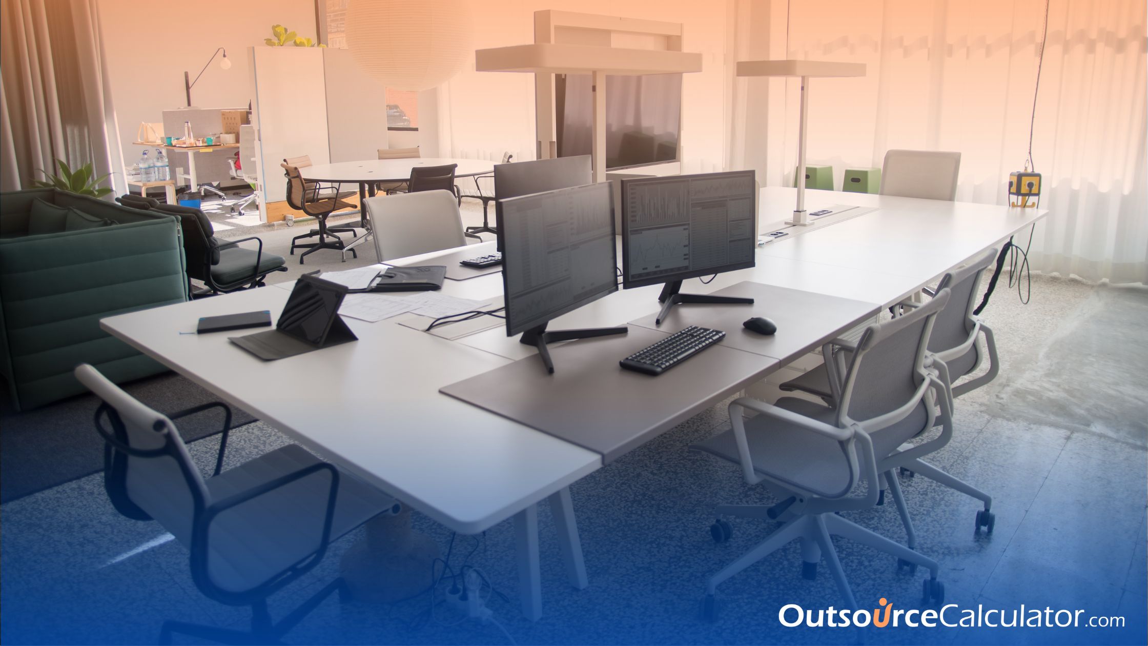 an empty workspace with computers on the table